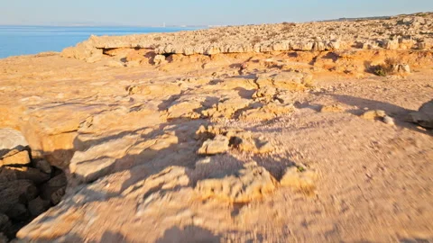 Drone view of narrow limestone openings at Cape Cavo Greco Sea Caves. Stock Footage 341540370