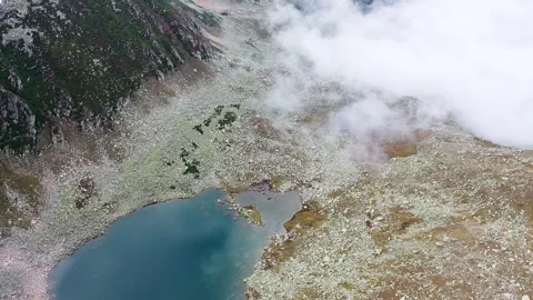 Drone view of the naturally formed heart-shaped lake among the mountains. Riz Stock Footage 251701092