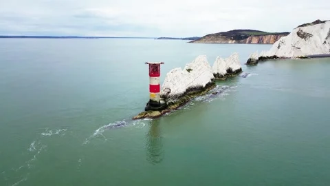Drone View of The Needles and Lighthouse with Isle of Wight Coast Behind Stock Footage 337998547