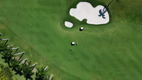Drone view of nice sand trap and golf carts on lush green golf course. Exclusive Video stock 255799978