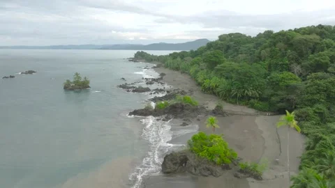 Drone view of Nuquí's rugged cliffs and Pacific waves Stock Footage 283912903
