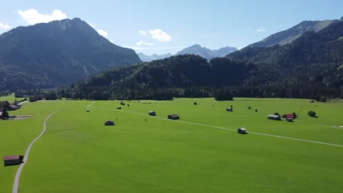 Drone View of Oberstdorf with Green Meadows in the Valley Stock Footage 280362549