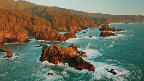 Drone View of Ocean with Rock Formations and Distant Mountains Stock Footage 315098858