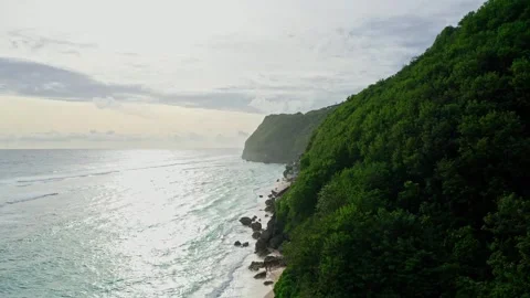 Drone view of ocean wave and cliff, sunset shore in Bali, 2K Stock Footage 246163192