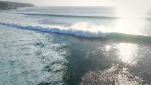 Drone view with ocean waves and surfers in ocean on Impossibles beach 動画素材 342542012