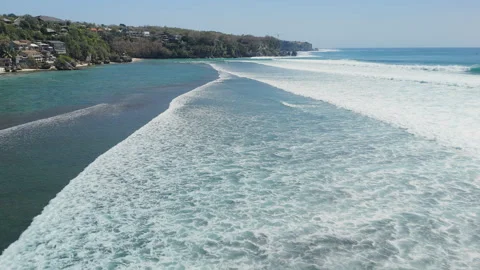 Drone view with ocean waves and surfers in ocean on Impossibles beach Stock Footage 345366891