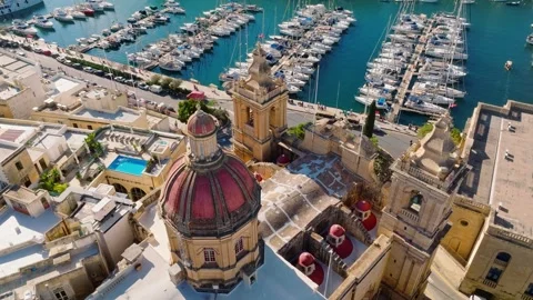 Drone view of old Birgu city and church dome. Marina, yachts. Malta island Stock Footage 323660413