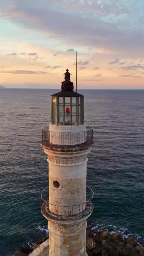 Drone view of the old lighthouse in Chania at sunset over the sea. Stock Footage 335042992