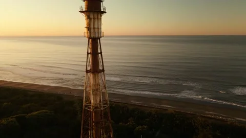 Drone view of an old lighthouse at sunrise Stock Footage 151468552
