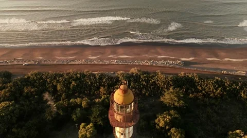 Drone view of an old lighthouse at sunrise Stock Footage 151470584