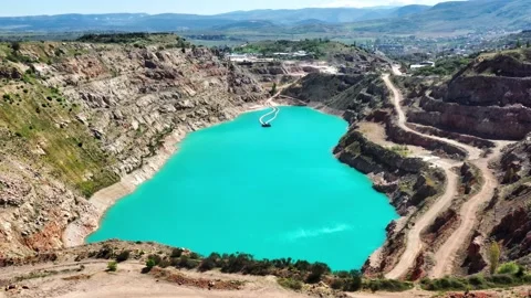 Drone view of open cast mine. Earthmoving work in open pit mining. Turquoise Vidéo 153796056