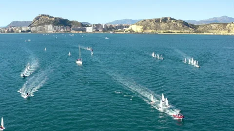 Drone view of Optimist sailboats type in regatta in Alicante bay, Spain. Stock Footage 325831100