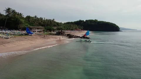 Drone View of Outrigger Boat Approaching Virgin Beach in Bali Stock Footage 337802306