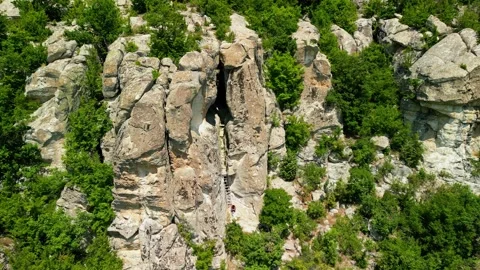 Drone view over Ancient Thracian sanctuary - Utroba cave above Kardzhali dam. Stock Footage 256037710