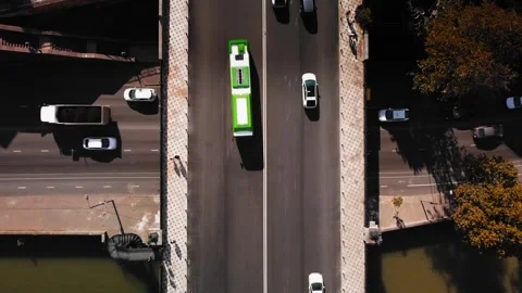 Drone view over busy daytime interchange showing multiple cars at concrete Stock Footage 343961483