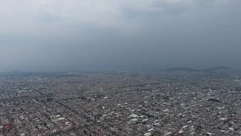 Drone view over Ecatepec during an electrical storm Stock Footage 310220074