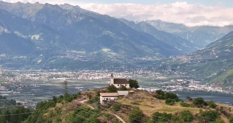 Drone view over Etschtal toward Merano with St Hippolyt church Stock Footage 316910118