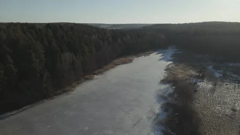 Drone view over the frozen river Stock Footage 240865555