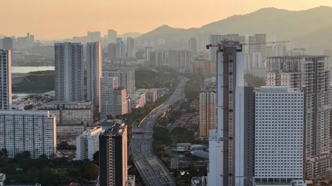 Drone View over George Town Highrise Corridor at Dusk Stock Footage 332096584