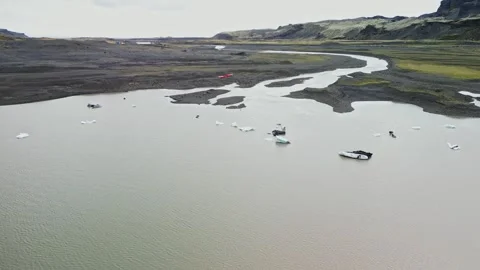 Drone view over glacial lagoon and braided river Iceland 4K Stock-Footage 343869671