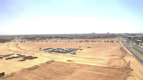 Drone view over graded plots and temporary site buildings 库存影片 346425331
