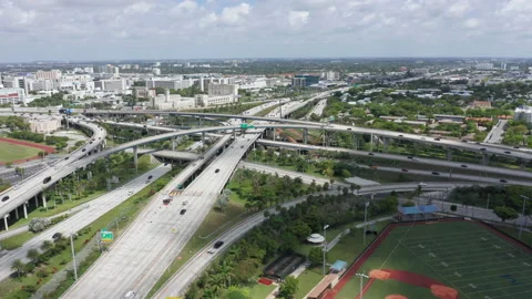 Drone view over intersection in Miami suburban, 4k aerial transportation and Vidéo 134443711