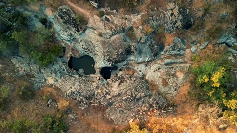 Drone view over the Kazankite waterfall near the town of Topolovgrad Stock Footage 230473757