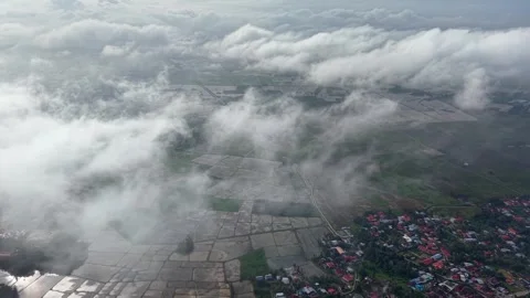 Drone view over misty Bukit Mertajam rice paddies and town Видео 329238733