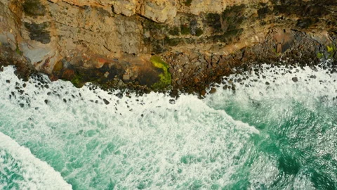 Drone view over ocean and shore with stones, on summer sunny day.  Ocean wave Stock Footage 197269143