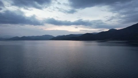 Drone view over peaceful lake and green islands in China Stock Footage 337757363
