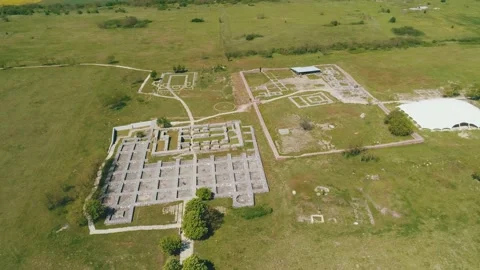 Drone view over Pliska, Bulgaria and the Ruins of The Great Basilica Vídeo Stock 138707192