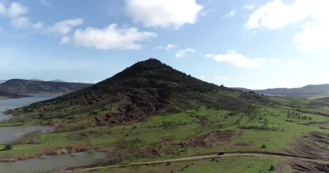 Drone view over red mountain Lake Salagou during the day in South of France Stock Footage 196300893