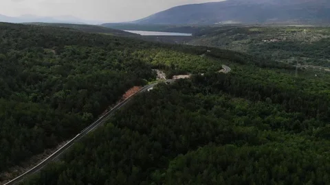 Drone view over the road among green hills Stock Footage 112333390