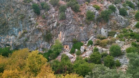 Drone view over Rock tombs of Pinara ancient city in Lycia, Antalya, Turkey	 Stock Footage 231240890
