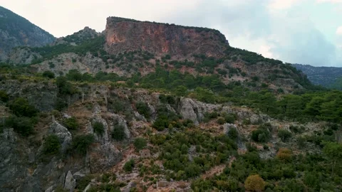 Drone view over Rock tombs of Pinara ancient city in Lycia, Antalya, Turkey	 Stock Footage 231241264