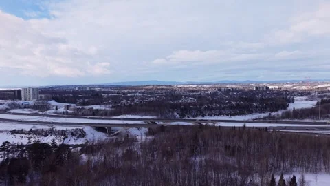 Drone view over snow covered city and frozen river landscape Stock Footage 328962980