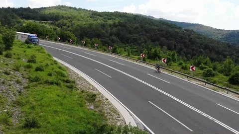 Drone view over some cyclists on the road Stock Footage 112333363