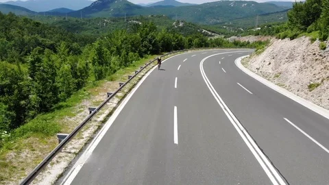 Drone view over some cyclists on the road Stock Footage 112333364