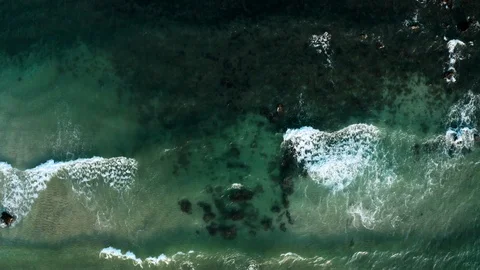 Drone view overlooking the wavy beach. Top view. Stock Footage 116430015