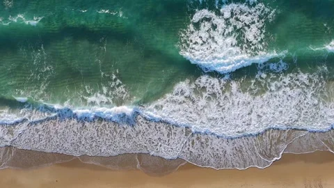 Drone view of Palm beach where ocean meeting sand. Waves breaking on shore and Stock Footage 275906564