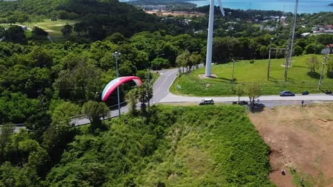 Drone view of paraglide flight along the tropical coast 動画素材 173720479