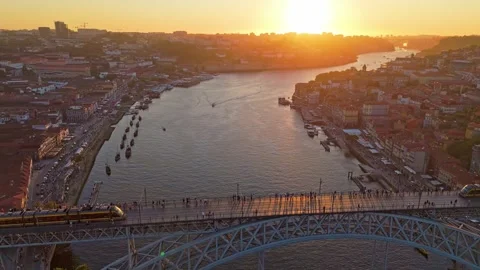 Drone View of passing tram on Dom Luis I Bridge at sunset Vídeos de archivo 346658097