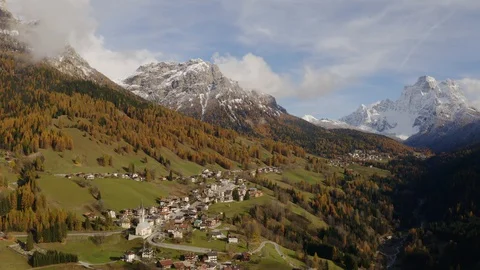 Drone view of the Pelmo mountain and  the small village of Selva di Cadore Stock Footage 129561776