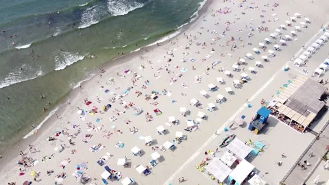 Drone view of people having a rest on the beach Stock Footage 157374173
