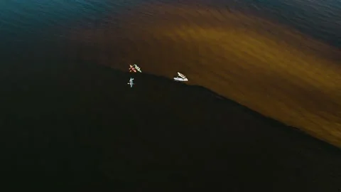Drone view of people kayaking during summer holidays at sunset Stock Footage 200102707