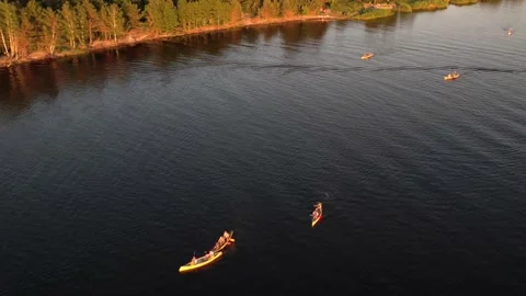 Drone view of people kayaking during summer holidays at sunset Stock Footage 200103386