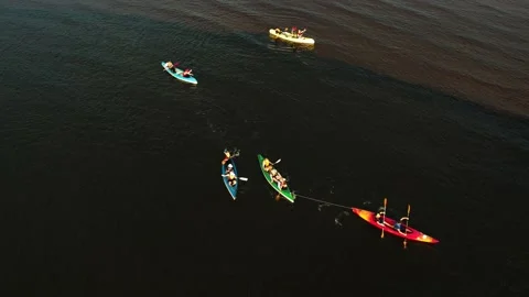 Drone view of people kayaking during summer holidays at sunset Stock Footage 200103577
