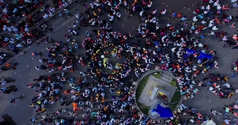 Drone view of people playing drums during immersion of lord Ganesha Stock Footage 340083982