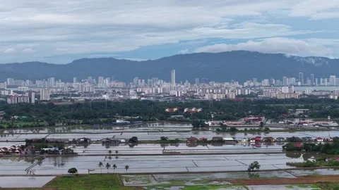 Drone view of Perai flood plains and city skyline Видео 329363157