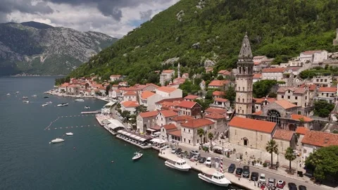 Drone View of Perast Waterfront and St Nicholas Bell Tower, 4K Stock Footage 337180042